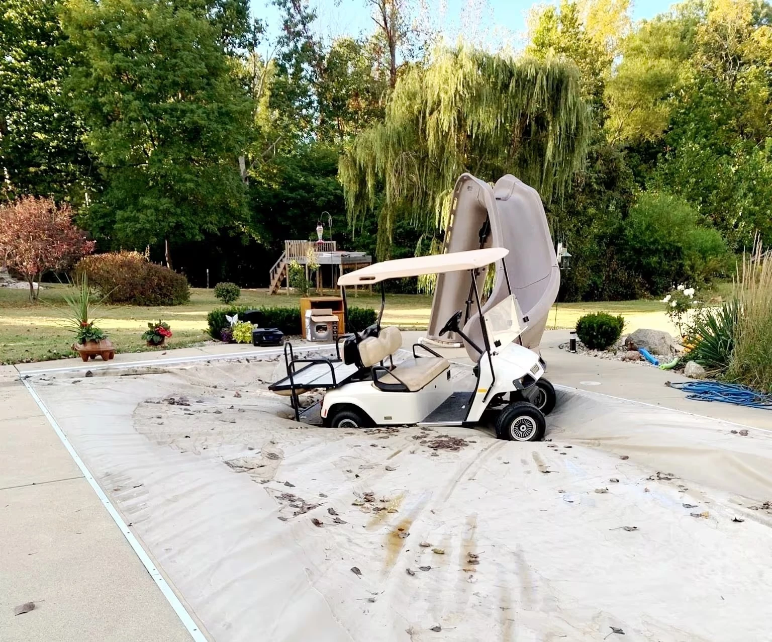 A real Pool Patrol customer's cover holding the weight of a golf cart driven on it by a 4-year-old. That's the kind of load a properly maintained cover is built to take.