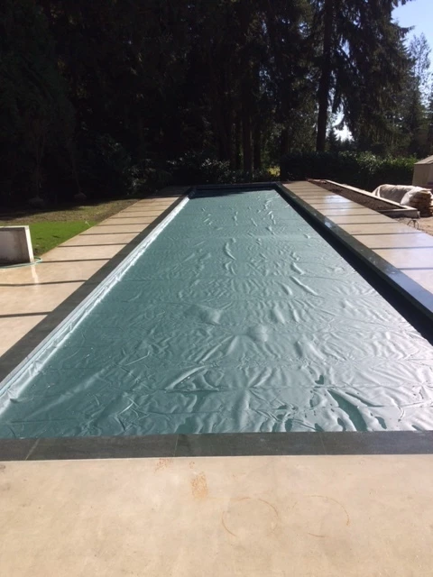 Possibly the longest pool cover in Canada at 95 feet long