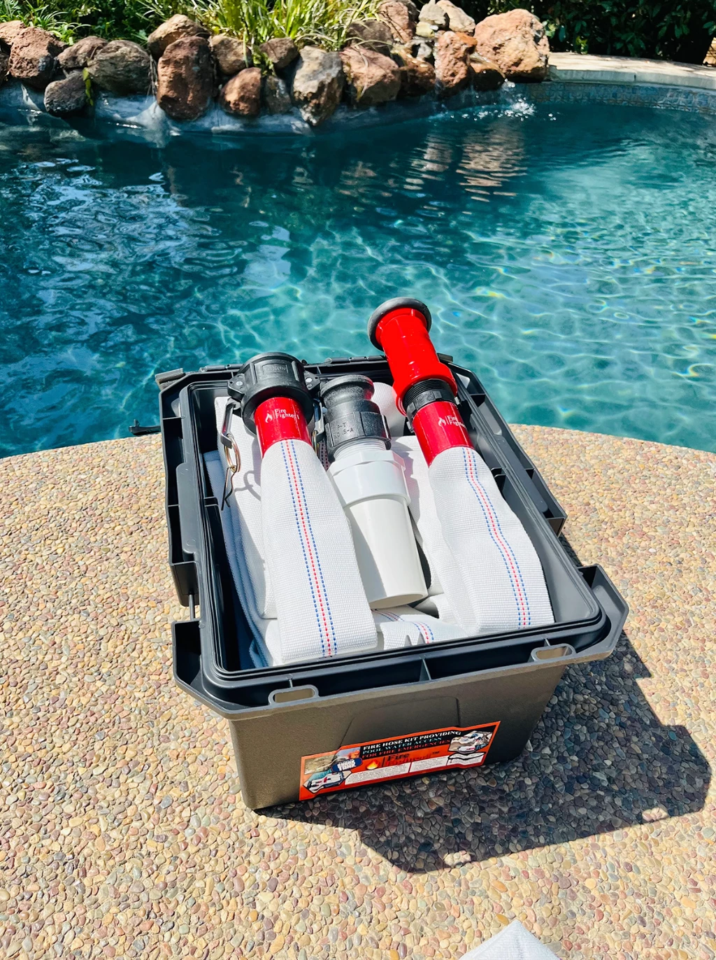 FireFighter1 system in its package shown sitting ons a pool deck in the okanagan valley beside the water